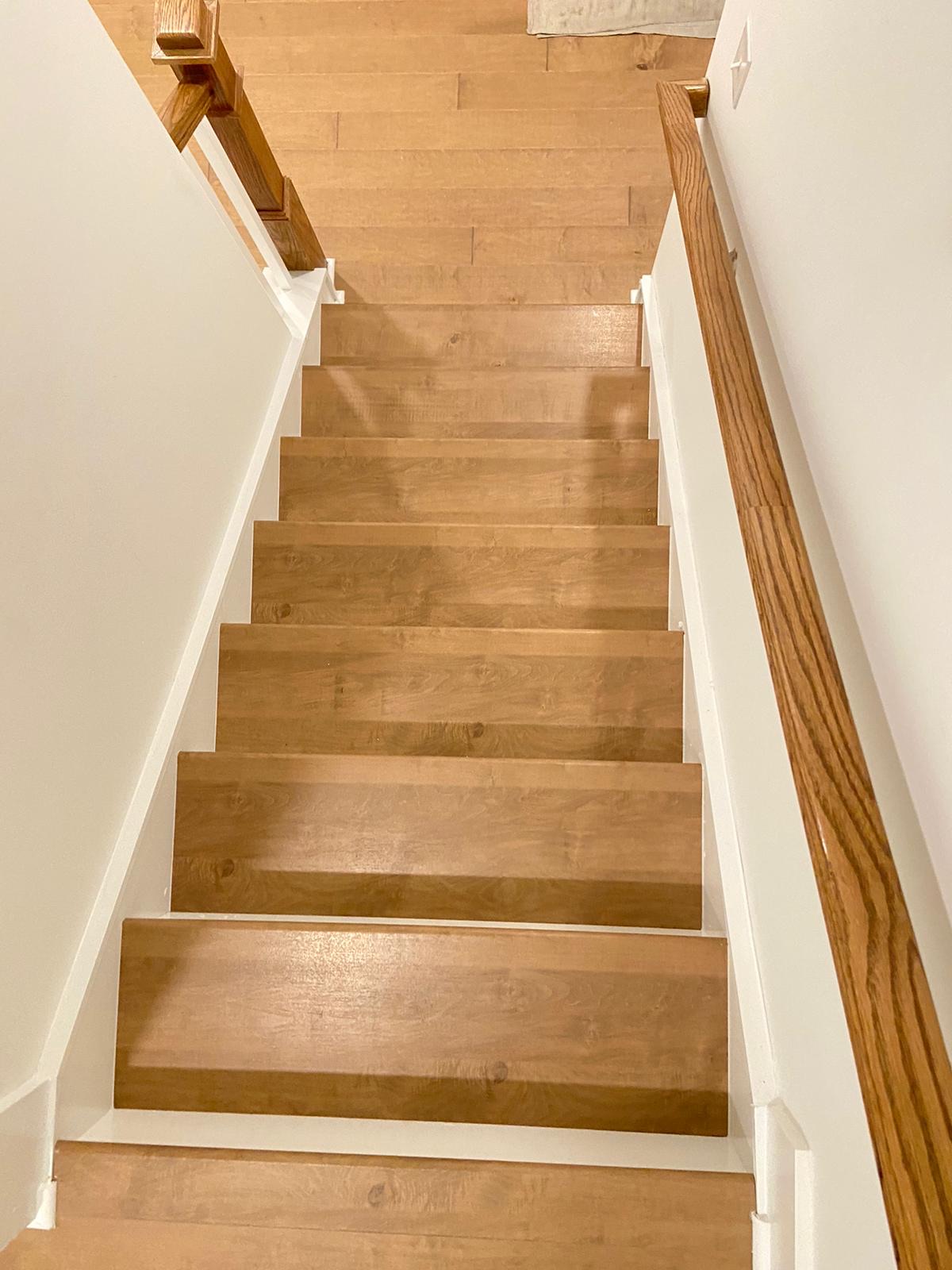 Warm maple staircase with matching handrail