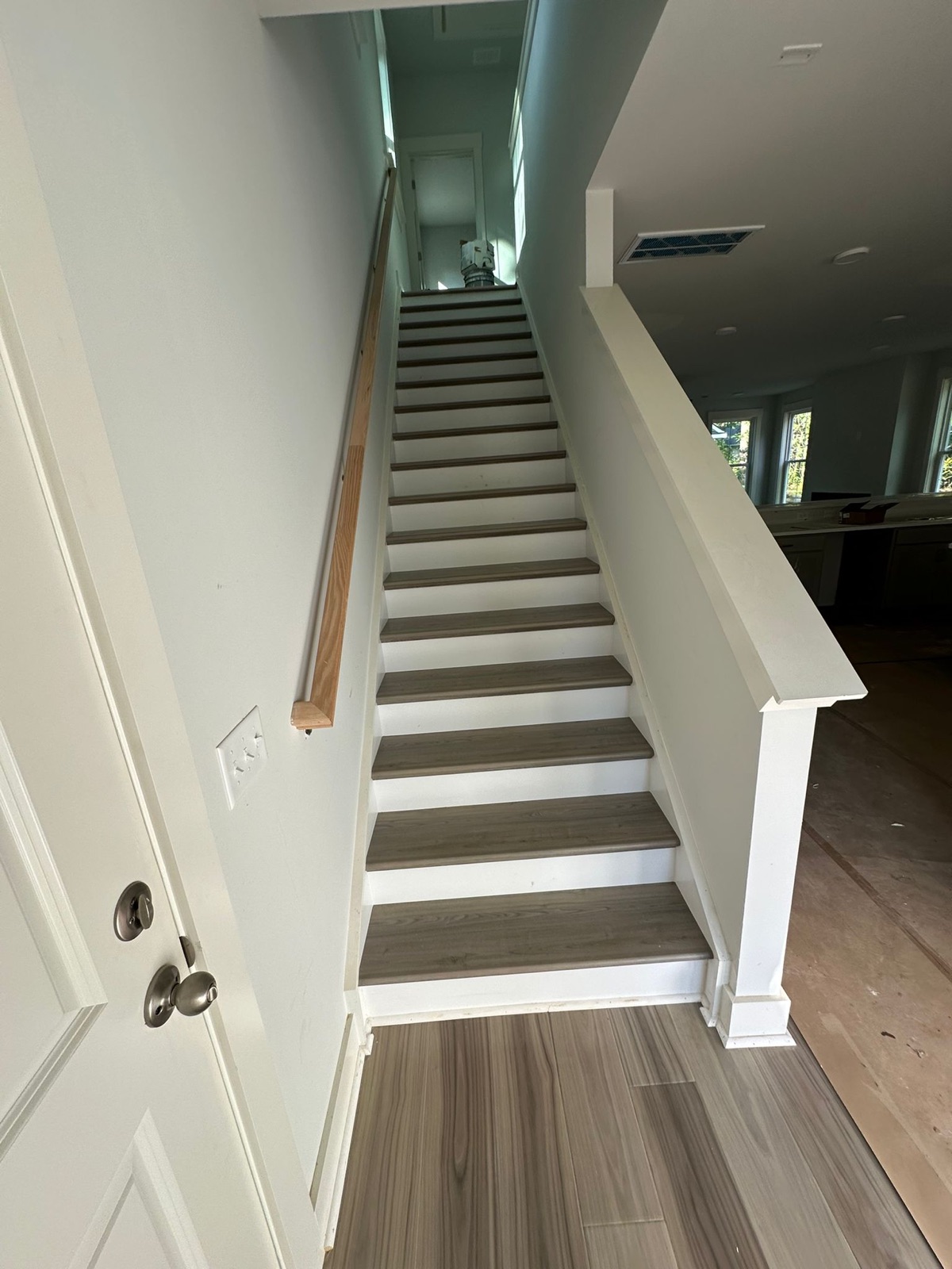 Long staircase run with gray-toned treads