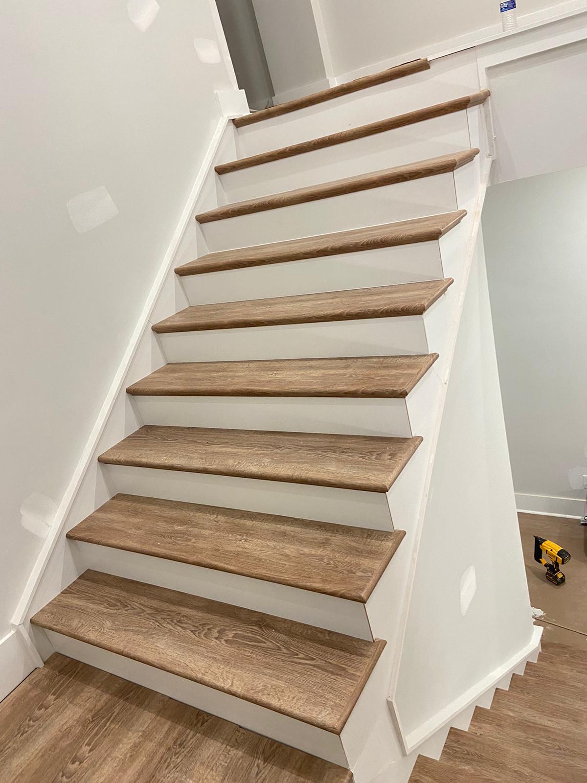 Angled view of light oak staircase installation